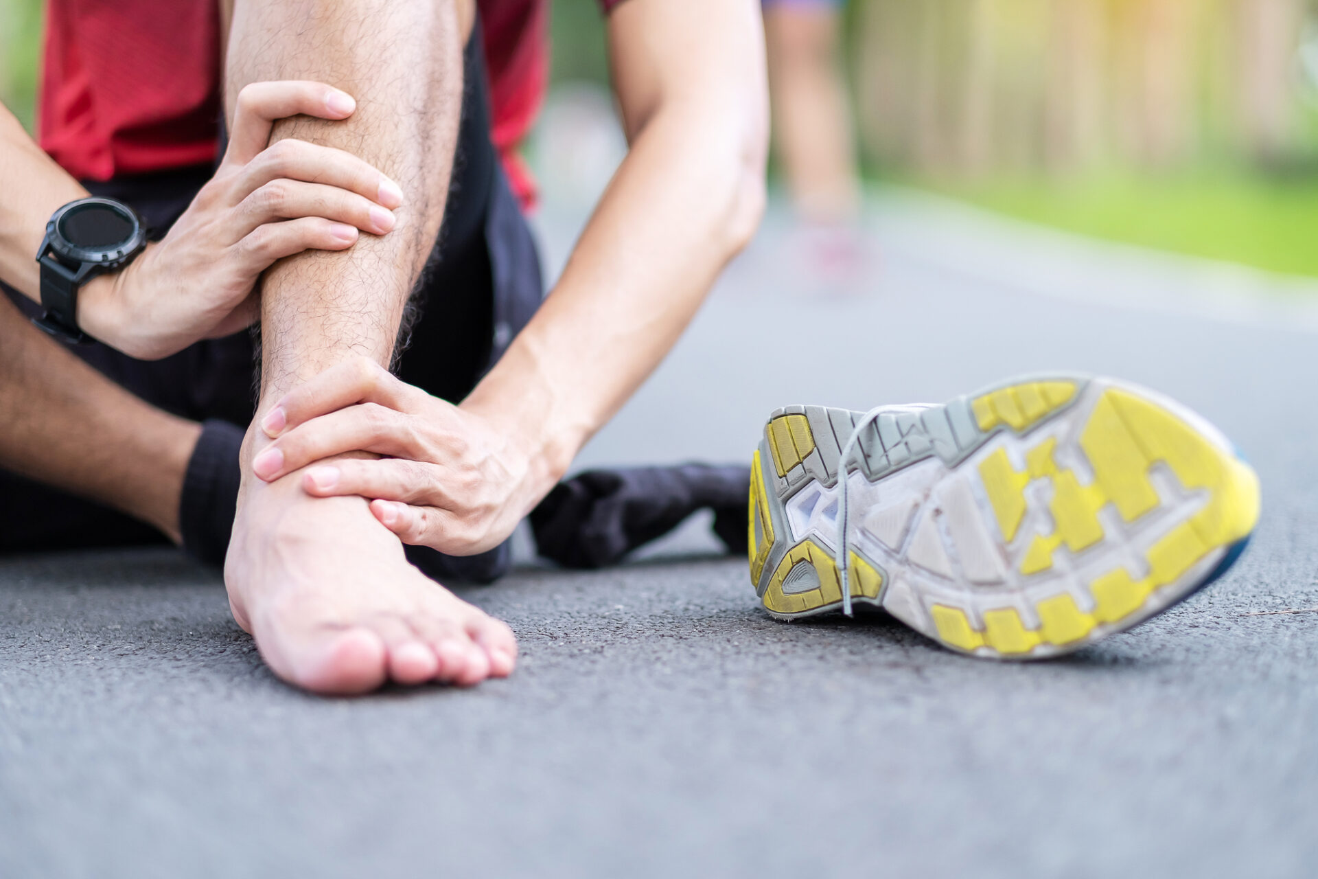 Young adult male with his muscle pain during running. runner man